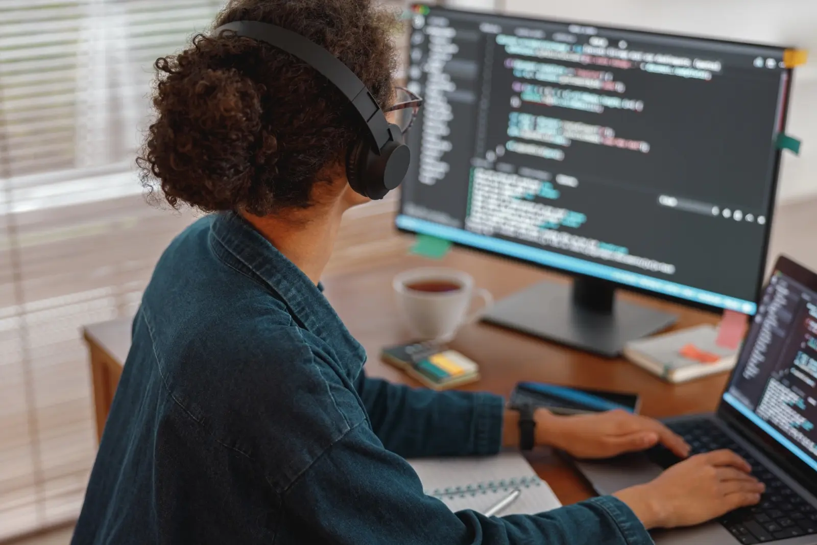 Woman using a desktop computer.