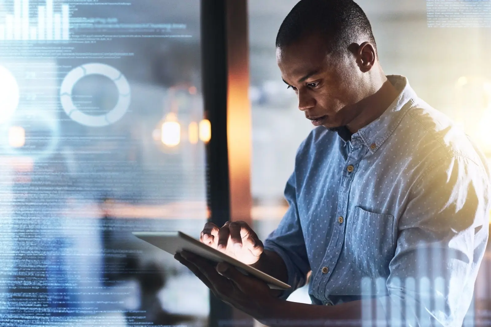 Man looking at a tablet.